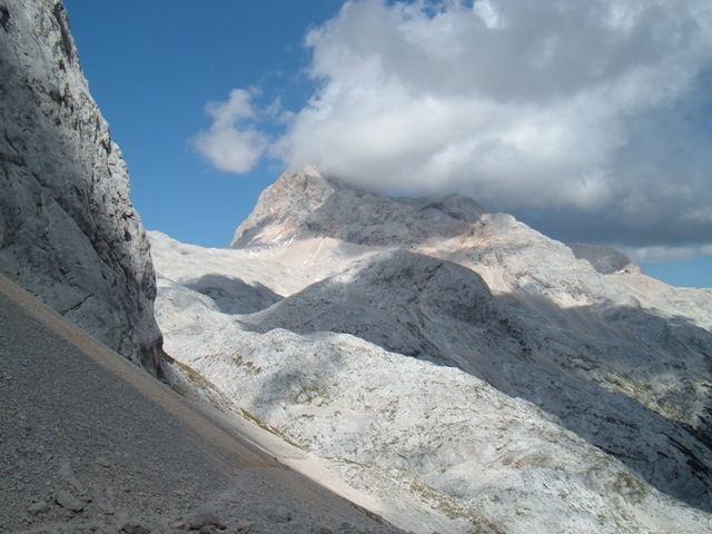 Looking back to a clouded-over Triglav from the climb to the Hribarice plateau